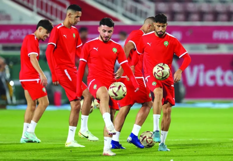 Morocco’s players take part in a training session at the Al Duhail SC Stadium in Doha yesterday, on the eve of the Qatar 2022 World Cup football semi-final against France. (AFP)