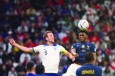 England’s forward Harry Kane and France’s midfielder Aurelien Tchouameni (right) fight for a header during their Qatar 2022 World Cup quarter-final match at the Al Bayt Stadium in Al Khor, on Saturday. (AFP)