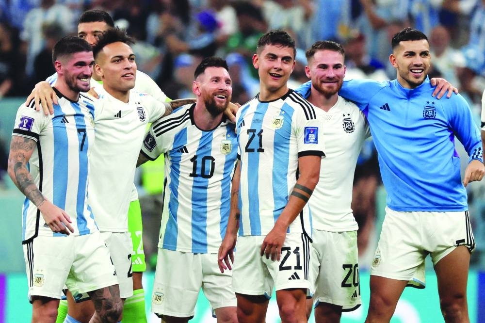 Argentina’s forward Julian Alvarez (left) celebrates scoring his team’s third goal with teammates during the Qatar 2022 World Cup semi-final against Croatia at Lusail Stadium yesterday. (AFP)