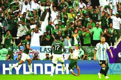 Saudi Arabia’s midfielder Salem al-Dawsari (second right) celebrates scoring his team’s second goal during the Qatar 2022 World Cup Group C match against Argentina at the Lusail Stadium, on November 22, 2022. (AFP)