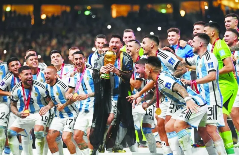 The Argentina squad celebrating with the trophy.