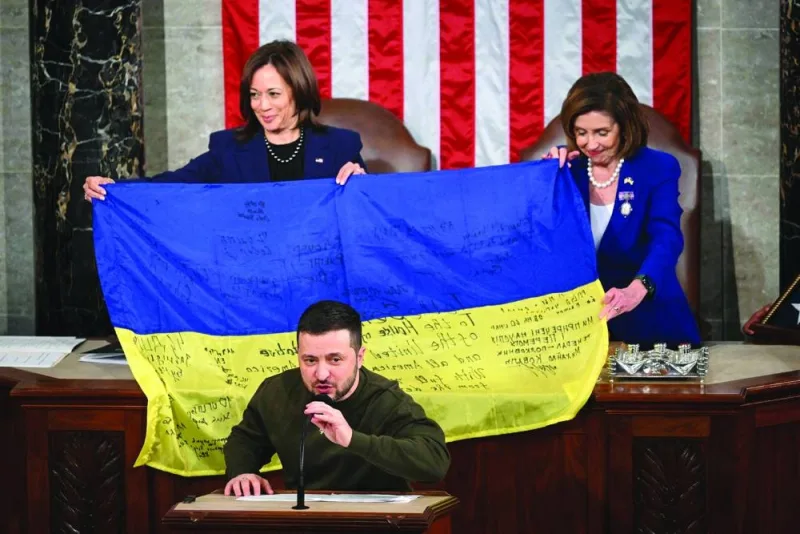 Ukraine’s President Volodymyr Zelensky speaks after giving a Ukrainian national flag to US House Speaker Nancy Pelosi and US Vice-President Kamala Harris during his address the US Congress at the US Capitol in Washington, DC.