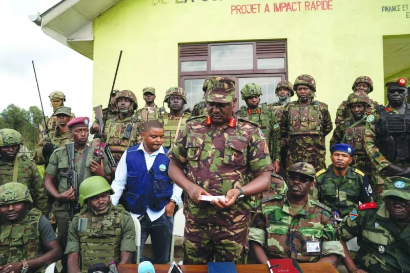 Officials of the East African Regional Force (EACRF) meet with the M23 rebels during the handover ceremony in Kibumba, eastern Democratic Republic of Congo, yesterday.
