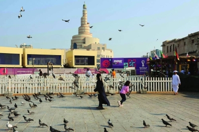  Children play among pigeons at a square at the Souq Waqif market in Doha Tuesday. Qatar will continue high spending on projects supporting the local economy, HE the Minister of Finance Ali bin Ahmed al-Kuwari said and noted some 22 new projects will be implemented in 2023, at a total cost of QR9.8bn.