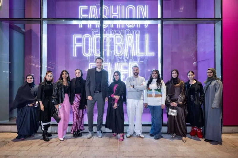 VCUarts Qatar&#039;s dean Amir Berbić along with students, alumni, and faculty at the window displays.