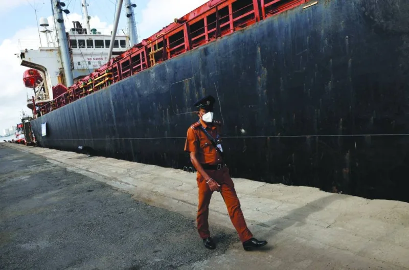 File photo shows a security officer walking in front of a cargo ship carrying humanitarian aid from India, amid the country’s economic crisis, at a port in Colombo, Sri Lanka.