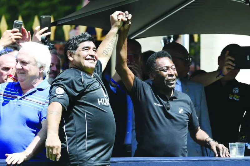 In this photo taken on June 9, 2016, Diego Maradona (left) and Pele attend a football match at the Jardin du Palais Royal in Paris on the eve of the Euro 2016.  (AFP)