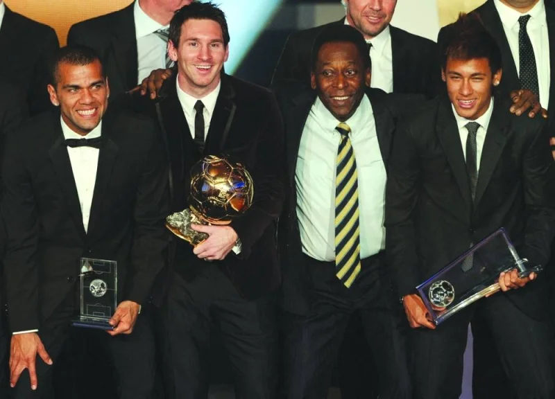 In this file photo taken on January 9, 2012, Barcelona&#039;s Argentinian forward Lionel Messi (2-L) poses with Brazilian football legend Pele (C), Barcelona&#039;s Brazilian Dani Alves (L) and Santos FC&#039; Brazilian forward Neymar (R) after receiving for the third time the FIFA Ballon d&#039;Or award at the Kongresshaus during the FIFA Ballon d&#039;Or ceremony in Zurich.