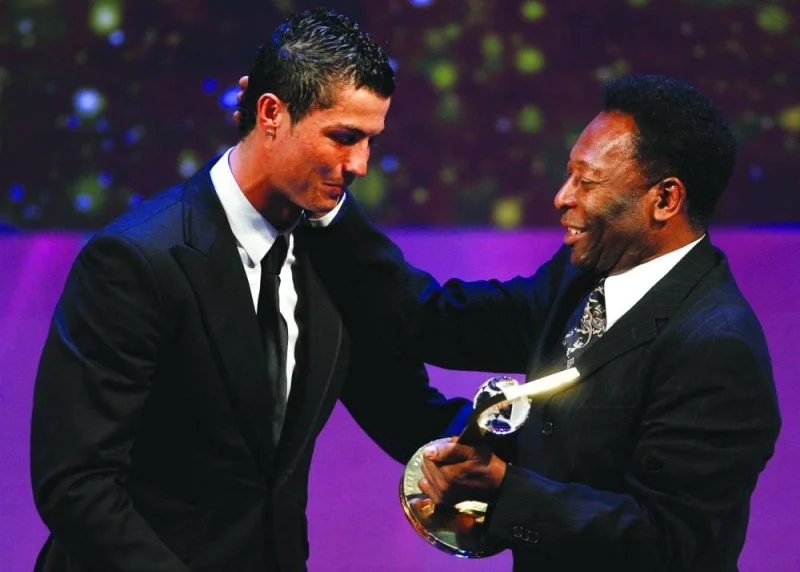 Cristiano Ronaldo of Portugal receives the FIFA World Player 2008 award from soccer legend Pele during the FIFA World Player of the Year awards ceremony in Zurich, Switzerland, January 12, 2009.