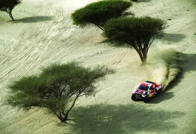 Toyota’s driver Nasser al-Attiyah of Qatar and his co-driver Mathieu Baumel of France compete during Stage 1 of the Dakar 2023 around Sea Camp by the Red Sea in Yanbu, Saudi Arabia, yesterday. (AFP)
