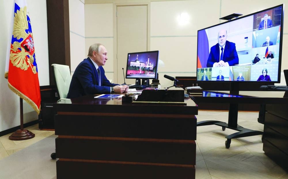 SPOTLIGHT: Russian President Vladimir Putin chairs a meeting on economic issues via a video link from the Novo-Ogaryovo state residence outside Moscow on Tuesday. (Reuters)