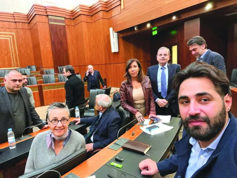 Lebanese lawmaker Firas Hamdan is seen with lawmakers Najat Saliba, Halime El Kaakour and others during a sit-in at the Lebanese parliament to pile pressure on dominant factions to elect a new president, in Beirut, on Friday.