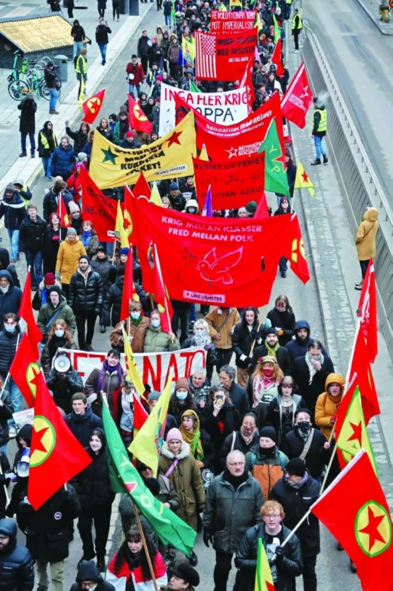 Participants march during a demonstration against Turkish President Recep Tayyip Erdogan and Sweden&#039;s NATO bid in Stockholm.