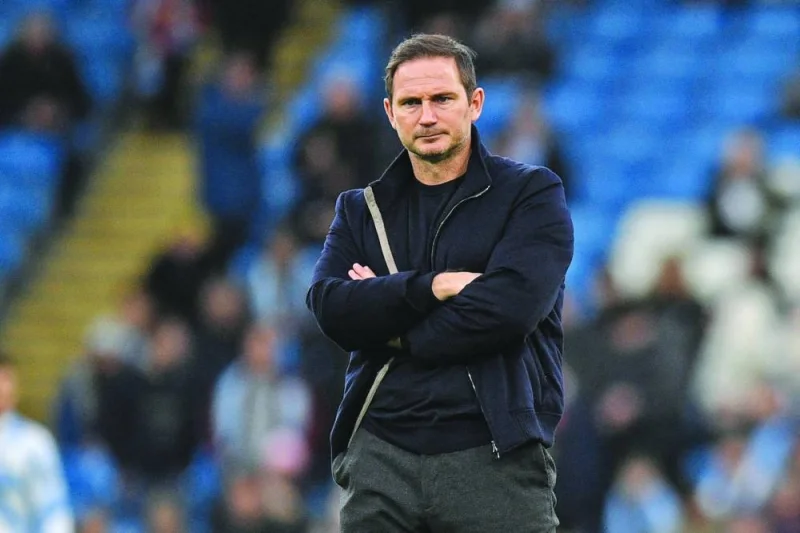 In this file photo taken on December 31, 2022 Everton’s English manager Frank Lampard watches his players warm up ahead of the English Premier League match against Manchester City at the Etihad  Stadium in Manchester, north west England. Relegation-threatened Everton have sacked Lampard after less than a year in charge at the Goodison Park club, British media reported yesterday. (AFP)