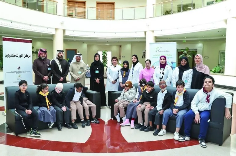 Officials of PHCC and Al Noor Institute with the students