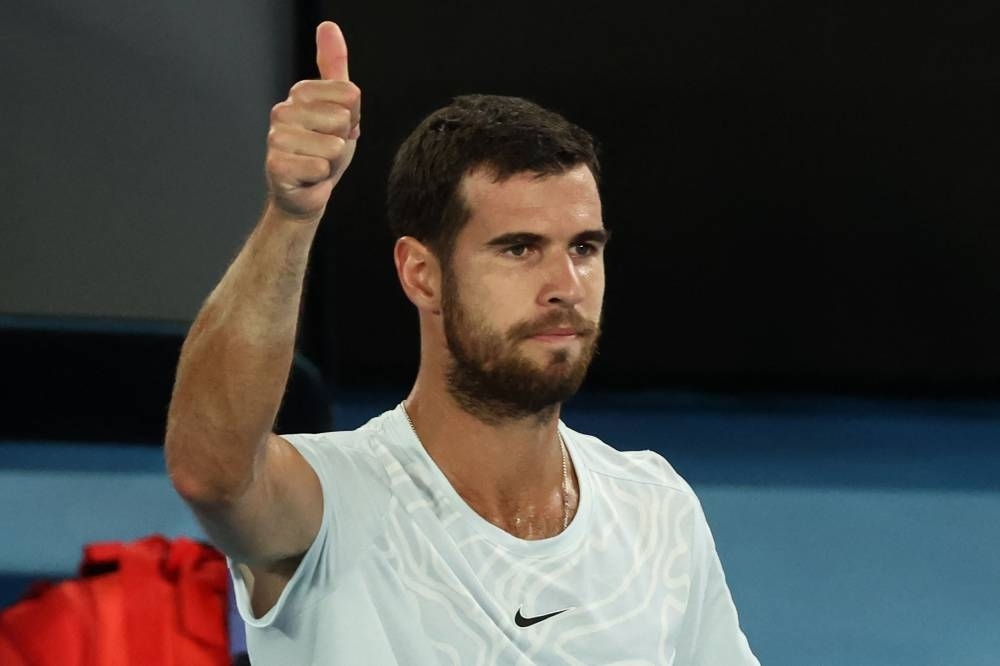 Russia&#039;s Karen Khachanov gives a thumbs up after winning the men&#039;s singles quarter-final match as USA&#039;s Sebastian Korda pulled out of the match due to injury (AFP)