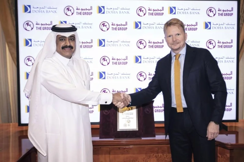 Adalsteinsson with Group Securities chairman Hamad bin Khalaf al-Moudadi after Q-Trade launch.