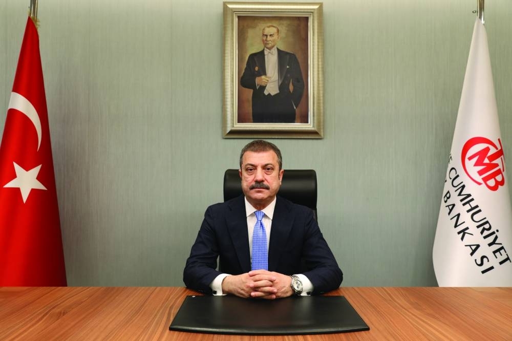 Turkiye’s central bank governor Sahap Kavcioglu at his office in Ankara (file). Presenting a quarterly economic report yesterday, Kavcioglu stood by previous year-end annual inflation forecasts for 2023 and 2024 of 22.3% and 8.8% respectively.