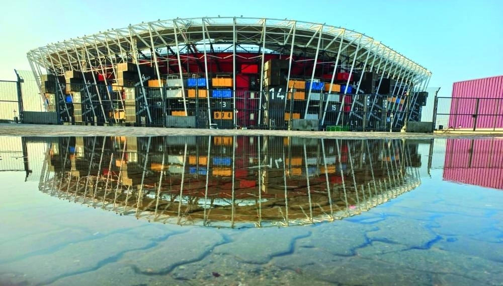 Reflected glory: The 974 World Cup Stadium is reflected in rainwater. PICTURE: Niyas T 