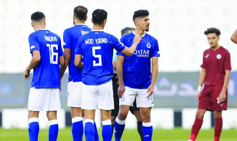 Al Sadd striker Baghdad Bounedjah (second right) celebrate with teammates after scoring against Al Markhiya in the QNB Stars League match at Al Sadd Stadium yesterday.