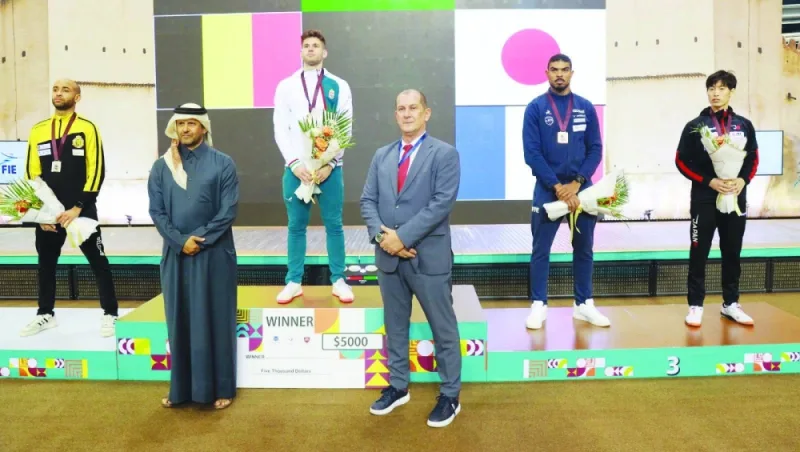 President of the Qatar Fencing Federation Abdullah Ali al-Maadeed poses with the winners of the men’s category on the final day of the Qatar Grand Prix Fencing Championship 2023 at the Aspire Dome in Doha yesterday.