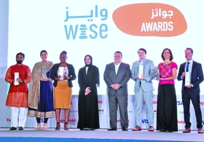 WISE Awards winners with HE the Minister of Education and Higher Education Buthaina bint Ali al-Jabr al-Nuaimi and WISE CEO Stavros N Yiannouka. PICTURE: Thajudheen