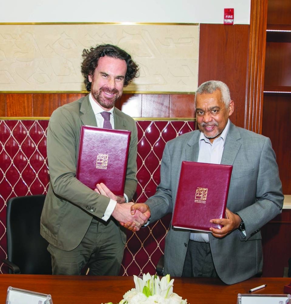 Dr Mathias Vicherat and Dr Abdelwahab El Affendi at the signing ceremony.