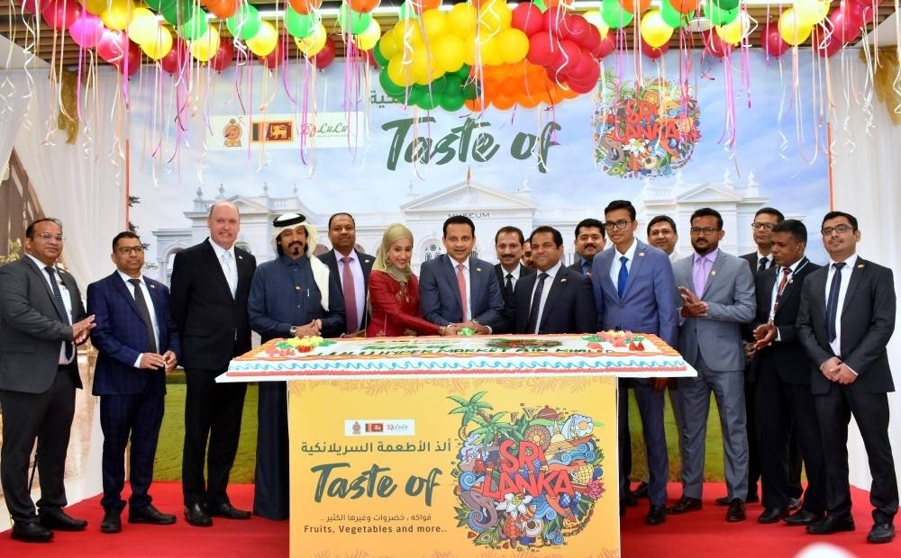 Dignitaries and guests participate in the cake-cutting ceremony.  PICTURE: Thajudheen