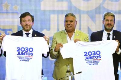 President of Conmebol Alejandro Dominguez (left), President of the Argentine Football Association Claudio “Chiqui” Tapia (centre) and Argentine Tourism and Sports Minister Matias Lammens (right) pose during a press conference to launch the joint candidacy of Uruguay, Argentina, Chile and Paraguay to organise the 2030 World Cup at AFA’s headquarters in Buenos Aires yesterday. (AFP)