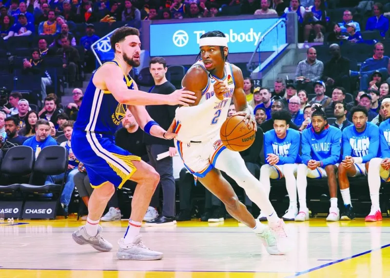 Oklahoma City Thunder shooting guard Shai Gilgeous-Alexander (2) controls the ball against Golden State Warriors shooting guard Klay Thompson (11) during the third quarter of their NBA game at Chase Center in San Francisco, California, USA. (USA TODAY Sports)
