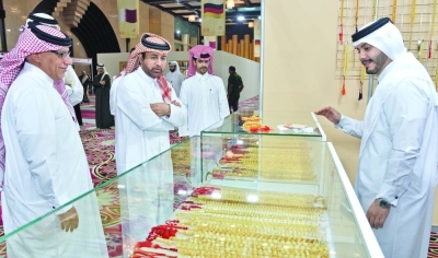 Katara - Cultural Village general manager Prof Dr Khalid bin Ibrahim al-Sulaiti tours the exhibition Friday. PICTURE: Shaji Kayamkulam
