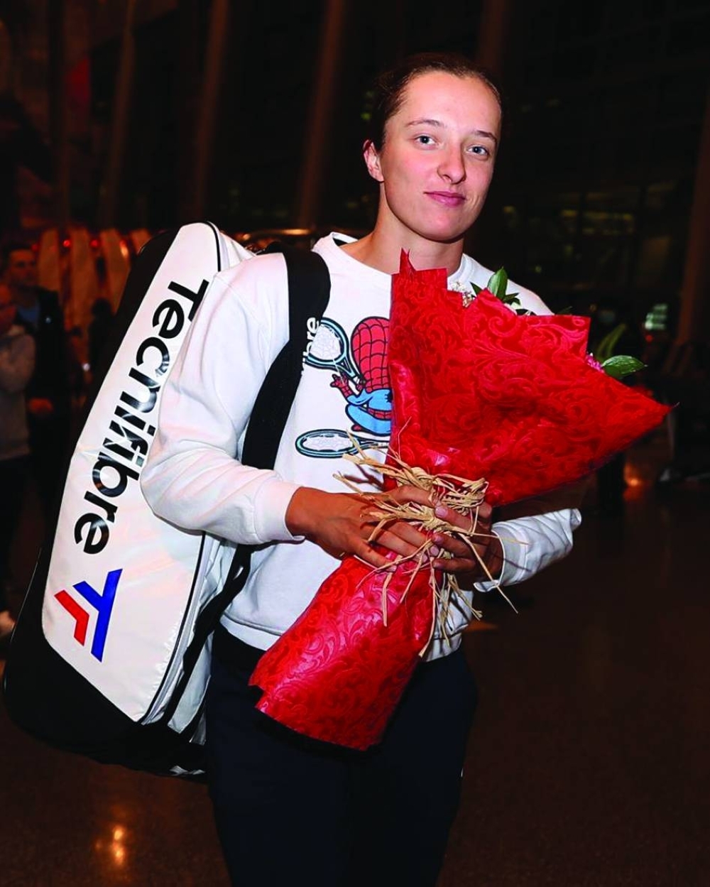 World No 1 Iga Swiatek of Poland poses on her arrival at the Hamad International Airport in Doha.