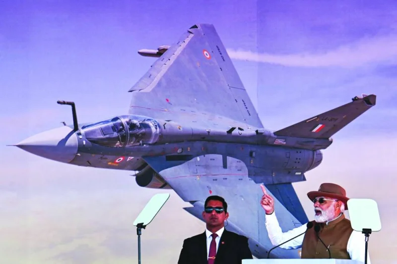 Indian Prime Minister Narendra Modi (right) speaks during the inauguration of the 14th edition of ‘Aero India 2023’ at the Yelahanka air force station in Bengaluru yesterday. (AFP)