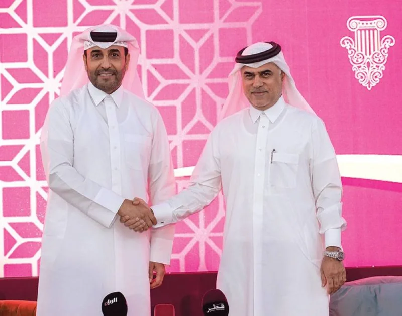 QREC Chairman Issa bin Mohamed al-Mohannadi (left) with CEO of Al Emadi Real Estate Enterprises Company and Al Hazm Mohamed Abdul Karim al-Emadi after signing sponsorship agreement yesterday. PICTURES: Juhaim