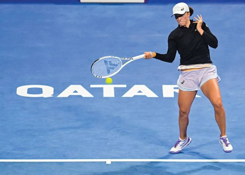 Iga Swiatek of Poland plays a shot against Danielle Collins of US at the WTA Qatar TotalEnergies Open in Doha. PICTURE: Noushad Thekkayil