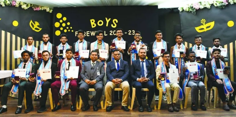Class XII boys with officials during the farewell ceremony.