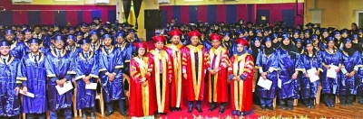 The students and officials at the graduation ceremony.