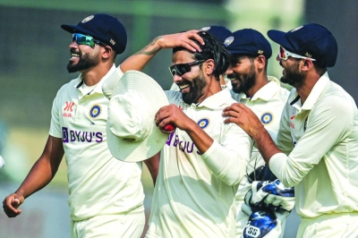 India’s Ravindra Jadeja (centre) celebrates with teammates after his seven-wicket haul in Australia’s second innings during the second Test in New Delhi yesterday. (AFP)
