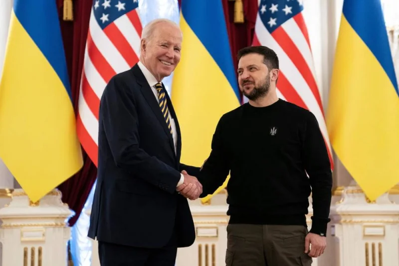 President Joe Biden shakes hands with Ukrainian President Volodymyr Zelensky at the Mariinsky Palace in Kyiv on February 20, 2023. (AFP)