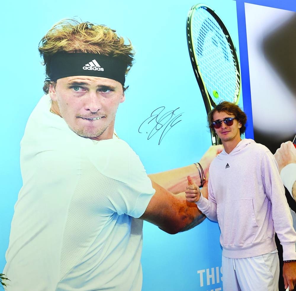 Alexander Zverev of Germany stands next to a poster of himself during the first day of the 2023 Qatar ExxonMobil Open at Khalifa Tennis and Squash Complex in Doha on Monday.  
