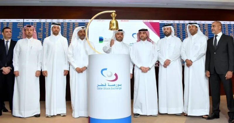 Sheikh Mohamed rings the customary bell to announce the advent of Dukhan Bank on QSE trading ring as other officials and dignitaries look on. PICTURE: Thajudheen