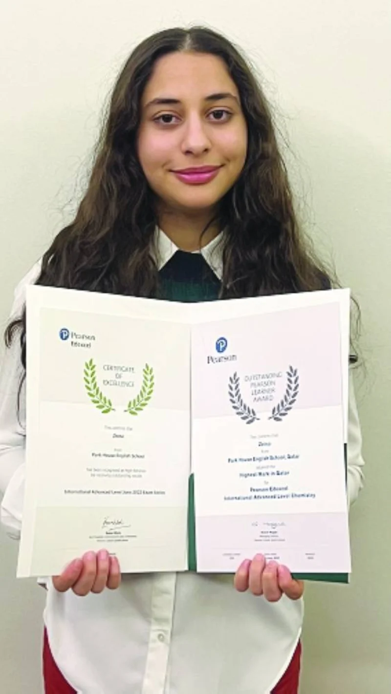 Zeina with Pearson Edexcel Certificate of Excellence and the Outstanding Pearson Learner Award.