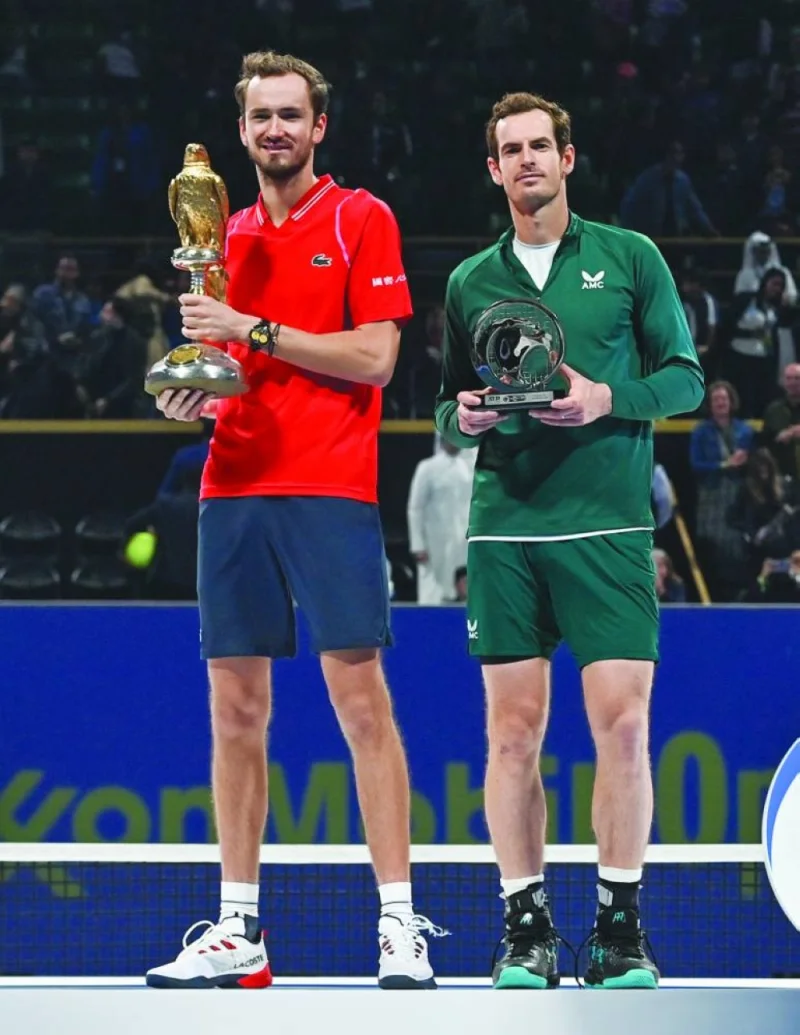 Daniil Medvedev (left) and Andy Murray pose with their trophies after the Qatar ExxonMobil Open final. PICTURE: Noushad Thekkayil
