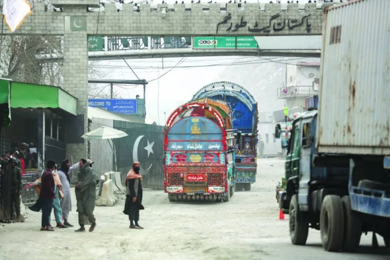 Goods carrier trucks cross into Pakistan at the zero point Torkham border crossing between Afghanistan and Pakistan, in Nangarhar province yesterday.  (AFP)