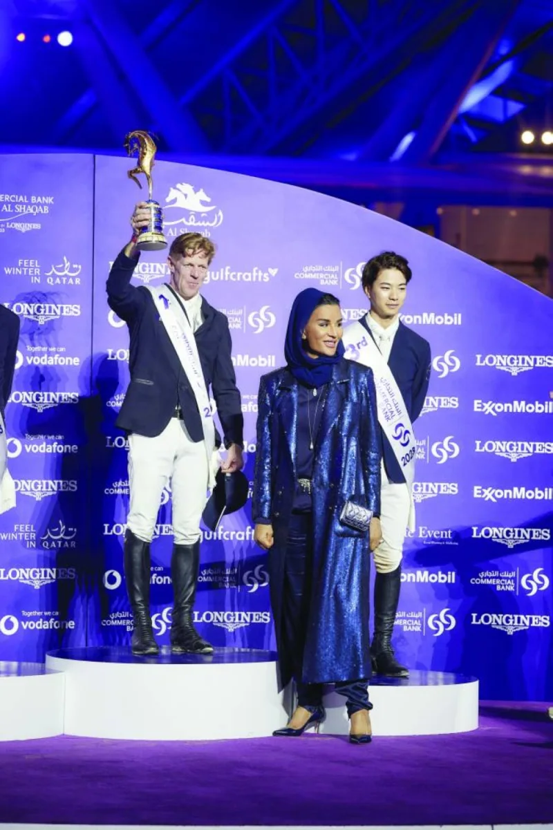 Her Highness Sheikha Moza bint Nasser, Chairperson of Qatar Foundation for Education, Science and Community Development (QF), poses with the podium winners of the Commercial Bank CHI Al Shaqab Grand Prix Presented by Longines yesterday. PICTURE: A R al-Baker