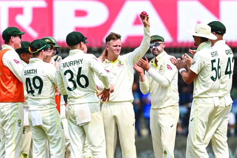 Australia’s Matthew Kuhnemann (centre) celebrates with teammates during the first day of the third Test against India at the Holkar Stadium in Indore on Wednesday. (AFP) 