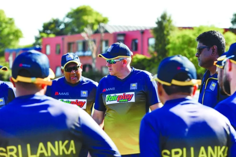 Sri Lankan cricket coach Chris Silverwoord talks to his players ahead of a warm-up match against a New Zealand XI in Lincoln on Saturday.