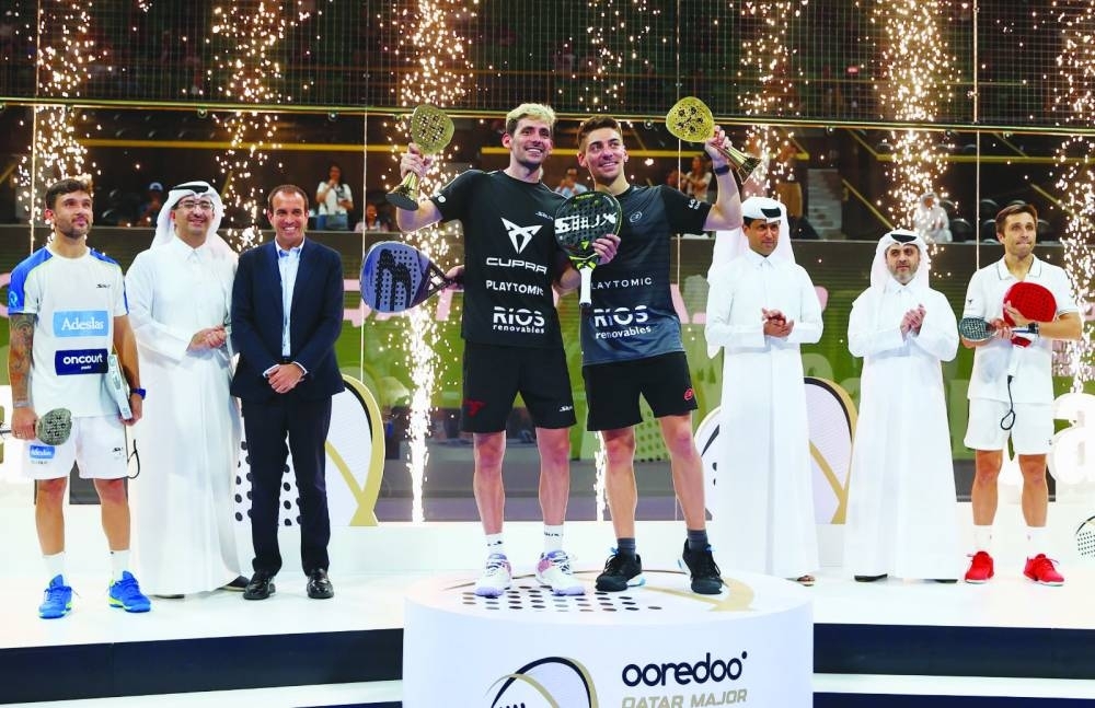 Champions Franco Stupaczuk and Martin Di Nenno are seen with losing finalists Fernando Belasteguin and C Daniel Gutierrez after trophies were handed to them by Sheikh Ali bin Jabor al-Thani, CEO of Ooredoo Qatar, Nasser al-Khelaifi, president of Qatar Tennis, Squash, Badminton and Padel Federation (QTSBPF), and secretary-general Tariq Zainal at Khalifa Tennis and Squash Complex in Doha yesterday. 