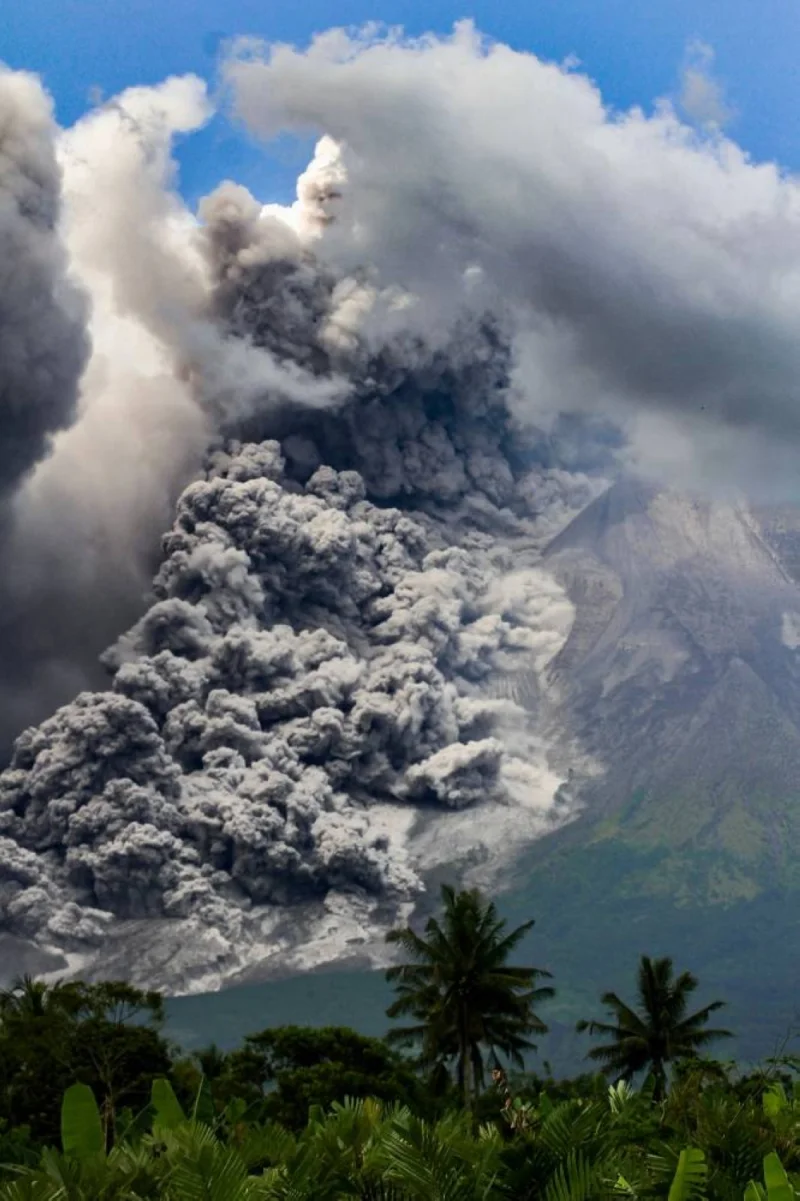 Thick smoke rises during an eruption from Mount Merapi, Indonesia’s most active volcano, as seen from Tunggularum village in Sleman on March 11, 2023. (AFP)