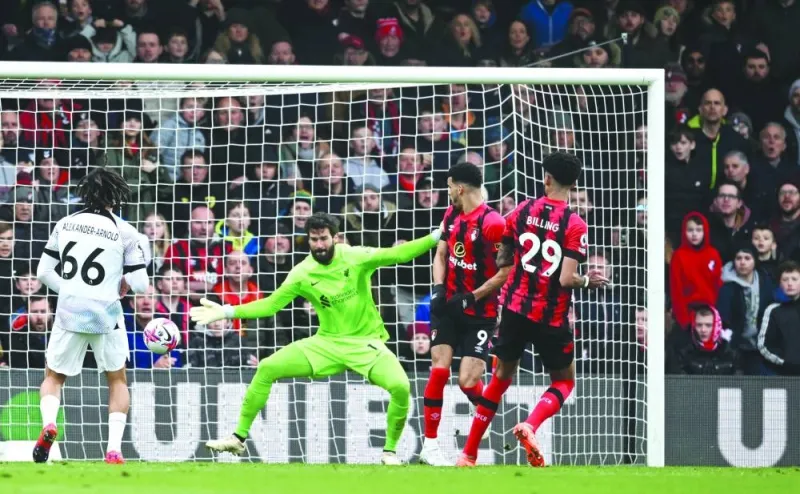Bournemouth’s Philip Billing (right) scores past Liverpool goalkeeper Alisson during the Premier League match. (Reuters) 